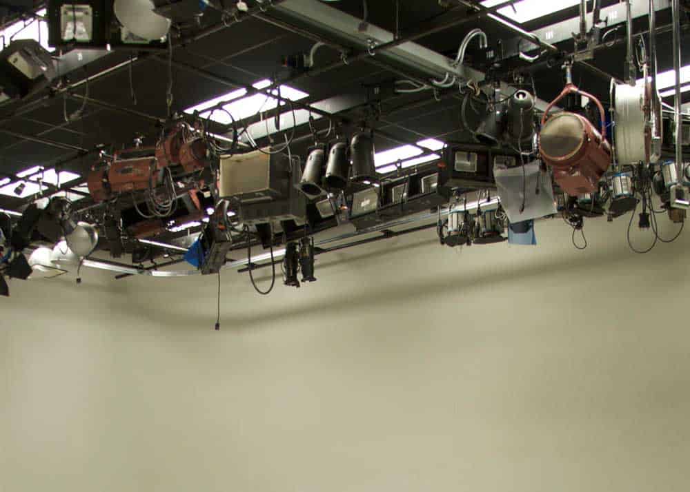 studio lighting hanging in the grid at a television studio
